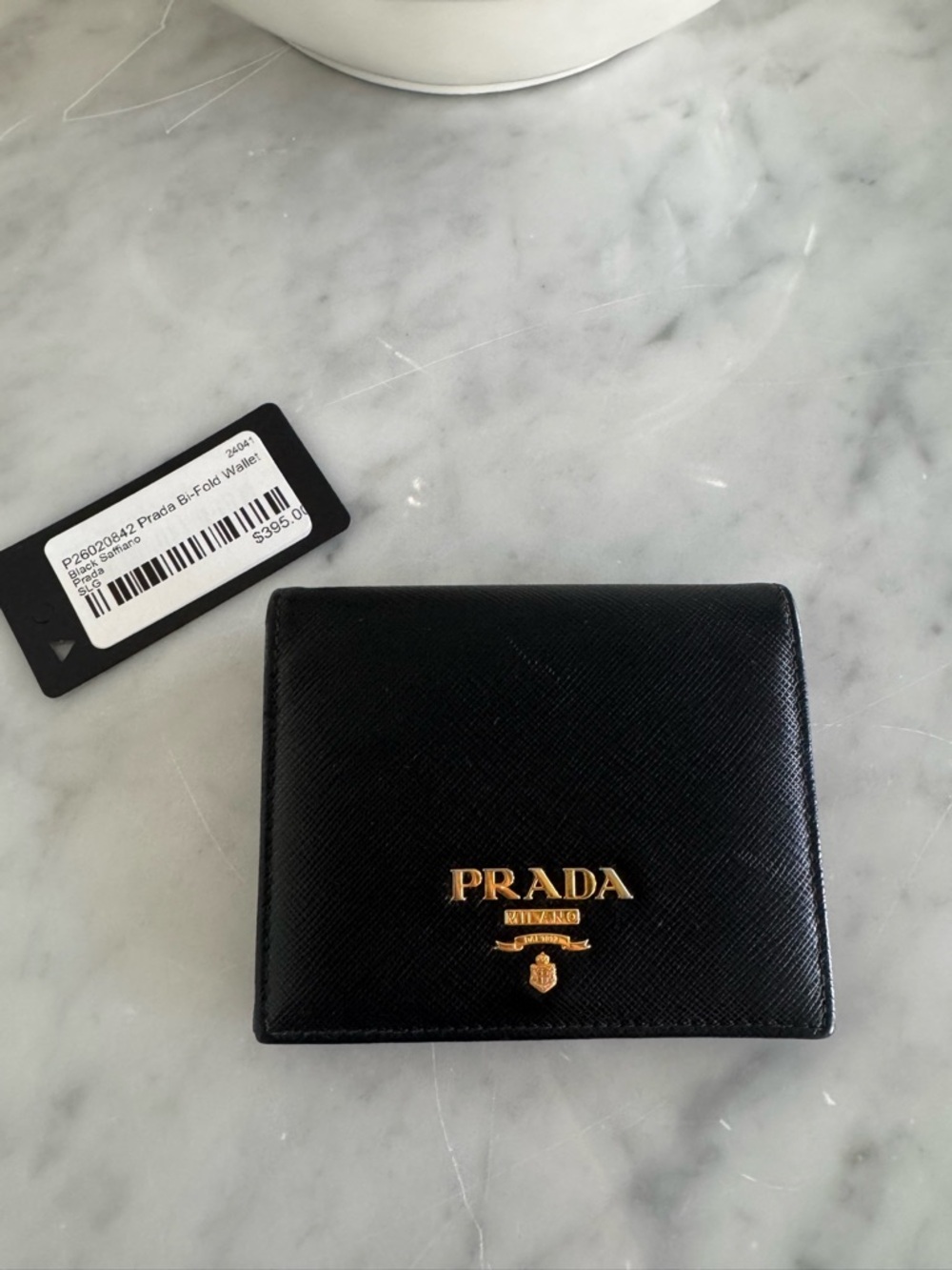 Prada bi-fold wallet black saffiano